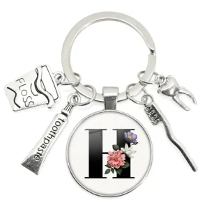 Shein 1 pieza de llavero con forma de cepillo de dientes y dientes de dentista, con letra H